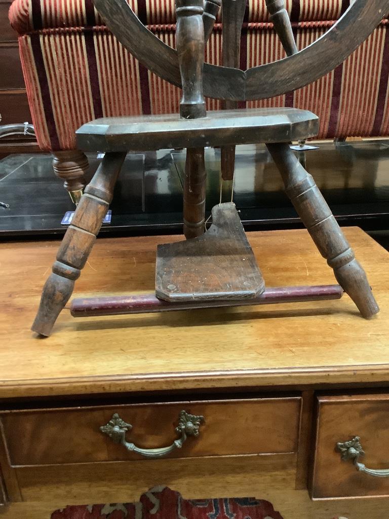 A provincial turned beech spinning wheel, height 100cm